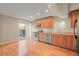 A bright kitchen with stainless steel appliances and sliding glass doors to the patio at 853 Huntington Dr, Highlands Ranch, CO 80126