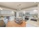 Well-lit kitchen featuring an island with wood accents, stainless steel appliances, and ample counter space and light cabinets at 853 Huntington Dr, Highlands Ranch, CO 80126