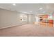 Open-concept living room features carpeted and wood flooring and abundant natural light at 853 Huntington Dr, Highlands Ranch, CO 80126