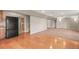 The living room features a smooth transition from hardwood to carpeted flooring at 853 Huntington Dr, Highlands Ranch, CO 80126