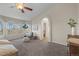 Bright main bedroom with vaulted ceilings, large windows, and stylish decor at 853 Huntington Dr, Highlands Ranch, CO 80126