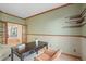 Cozy home office with warm wood trim, built-in shelves, and ample workspace at 853 Huntington Dr, Highlands Ranch, CO 80126