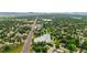 Aerial view of neighborhood lake, park, and streets at 9316 W Utah Ave, Lakewood, CO 80232