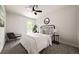 Cozy bedroom with ceiling fan, large window, bedside table and lamps at 9316 W Utah Ave, Lakewood, CO 80232