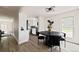 Open concept floor plan with dining area, hardwood floors and seamless flow into the kitchen at 9316 W Utah Ave, Lakewood, CO 80232