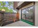 Private patio with sliding glass doors providing great natural light to the home at 9316 W Utah Ave, Lakewood, CO 80232