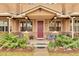 Inviting front porch with charming accents and a well-maintained walkway at 2686 S Cherokee St, Denver, CO 80223
