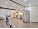 Basement kitchen with stainless steel refrigerator and sleek modern appliances at 2686 S Cherokee St, Denver, CO 80223