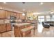 Open kitchen with stainless steel appliances, granite countertops, and easy access to the living area at 2686 S Cherokee St, Denver, CO 80223