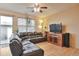 Cozy living room with a comfortable leather couch and great natural light at 2686 S Cherokee St, Denver, CO 80223