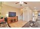 Spacious living room with modern entertainment center and hardwood flooring at 2686 S Cherokee St, Denver, CO 80223