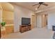 Comfortable living room with adjacent bathroom, and neutral colored walls at 2686 S Cherokee St, Denver, CO 80223
