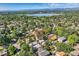 Property aerial view framed in red, revealing proximity to lake, town, and surrounding neighborhood amenities at 2692 N Raleigh St, Denver, CO 80212