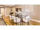 Elegant dining area featuring a glass table and stylish chairs next to the living room at 2692 N Raleigh St, Denver, CO 80212