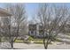 Modern home exterior as seen from the second story, framed by mature trees and the street view at 2692 N Raleigh St, Denver, CO 80212