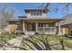 Charming brick home with a covered porch, showcasing a blend of traditional and modern architectural elements at 2692 N Raleigh St, Denver, CO 80212