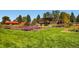 Beautiful garden with manicured lawns, colorful flowers, and shade structure at 2692 N Raleigh St, Denver, CO 80212