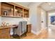 Inviting home office featuring custom built-ins, sleek wooden desk, and stylish decor with easy access to the hallway at 2692 N Raleigh St, Denver, CO 80212