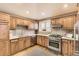 Well-equipped kitchen featuring stainless steel appliances, granite countertops, and ample cabinet space at 2692 N Raleigh St, Denver, CO 80212