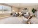 Comfortable living room featuring a gray sectional sofa, modern decor, and a window offering natural light at 2692 N Raleigh St, Denver, CO 80212