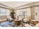Cozy living room featuring a modern sofa, patterned rug, and natural light at 2692 N Raleigh St, Denver, CO 80212