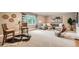 Cozy living room featuring neutral tones, comfortable seating, and a large window with a view of the outdoors at 2692 N Raleigh St, Denver, CO 80212