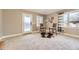 Bright living room with stylish high-top seating, neutral colors, and a door leading to the outside at 2692 N Raleigh St, Denver, CO 80212