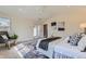 Bright main bedroom featuring soft carpet, bright windows, and stylish decor at 2692 N Raleigh St, Denver, CO 80212