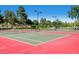 Outdoor tennis courts with mature trees, updated surface and nets in a community setting at 2692 N Raleigh St, Denver, CO 80212