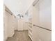 Organized walk-in closet with custom shelving, drawers, and ample storage space and window to the outside at 2692 N Raleigh St, Denver, CO 80212