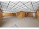 Spacious basement with wood paneling, carpet flooring, and recessed lighting perfect for entertaining at 9856 Keenan St, Highlands Ranch, CO 80130
