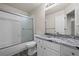 This bathroom features a shower and tub combination and a granite countertop vanity at 9856 Keenan St, Highlands Ranch, CO 80130
