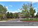 Community building featuring attractive architecture, landscaping, and ample parking for easy access to amenities at 9856 Keenan St, Highlands Ranch, CO 80130