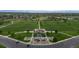 Overhead view of a well-maintained park featuring a playground and walking paths at 9856 Keenan St, Highlands Ranch, CO 80130