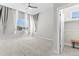 The bedroom offers a neutral color palette, plush carpeting, and ample natural light at 14301 E Tennessee Ave # 109, Aurora, CO 80012