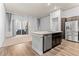 Modern kitchen with stainless steel appliances, breakfast bar, and a bright, airy feel at 14301 E Tennessee Ave # 109, Aurora, CO 80012
