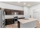 Well-equipped kitchen with stainless steel appliances, ample cabinetry, and a functional island at 14301 E Tennessee Ave # 109, Aurora, CO 80012