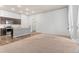 Open-concept living area featuring a breakfast bar, and a large window at 14301 E Tennessee Ave # 109, Aurora, CO 80012