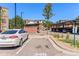 Parking lot featuring designated parking spots with covered areas providing shade for vehicles at 14301 E Tennessee Ave # 109, Aurora, CO 80012