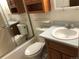Bathroom with a single sink, vanity, and a shower-tub combo with sliding glass door at 16359 W 10Th Ave # 1, Golden, CO 80401