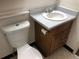 Cozy bathroom featuring a toilet and a vanity with a light blue countertop and wood cabinet at 16359 W 10Th Ave # 1, Golden, CO 80401