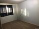 Bedroom with neutral walls, dark curtains and carpeted flooring at 16359 W 10Th Ave # 1, Golden, CO 80401