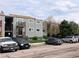 Exterior view of condo building with gray siding, brown trim, and private balcony at 16359 W 10Th Ave # 1, Golden, CO 80401
