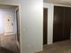 Hallway leading to the front door shows closet storage and access to living spaces at 16359 W 10Th Ave # 1, Golden, CO 80401