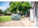 Backyard featuring a patio and green lawn at 2294 W Parkhill Ave, Littleton, CO 80120