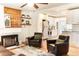 Bright, open living area that seamlessly connects to the kitchen, complete with a stylish fireplace and modern decor at 2294 W Parkhill Ave, Littleton, CO 80120
