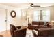 Bright living room with hardwood floors and comfortable leather furniture at 2294 W Parkhill Ave, Littleton, CO 80120