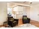 Bright living room with hardwood floors and comfortable leather furniture at 2294 W Parkhill Ave, Littleton, CO 80120