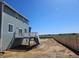 Expansive backyard of the house with a fence and deck, highlighting its size and boundary lines at 6046 Keyser Pl, Brighton, CO 80601