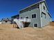 Exterior view of the backyard featuring a deck and ample yard space at 6046 Keyser Pl, Brighton, CO 80601